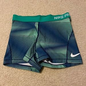 size M green and blue nike pros